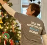 Photo of Molly Booker decorating a Christmas tree