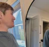 Photo of Molly Booker looking in the mirror