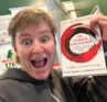 Molly Booker holding a copy of the book The Courage to Be Disliked